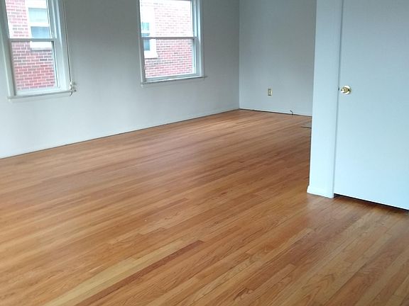 Dining area off living room with beautiful hardwood floors