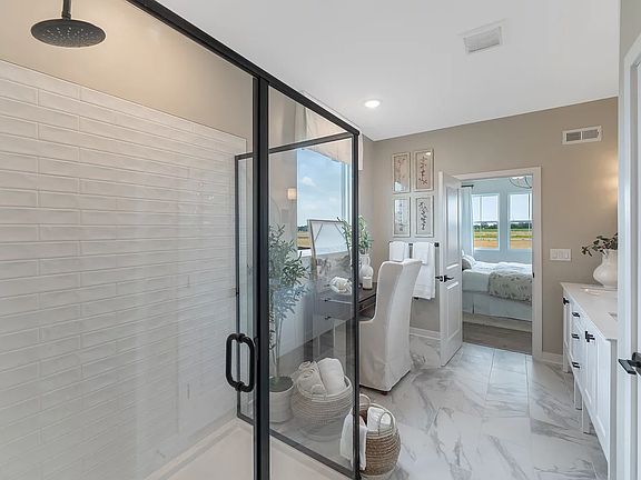 Primary bath with glass shower enclosure