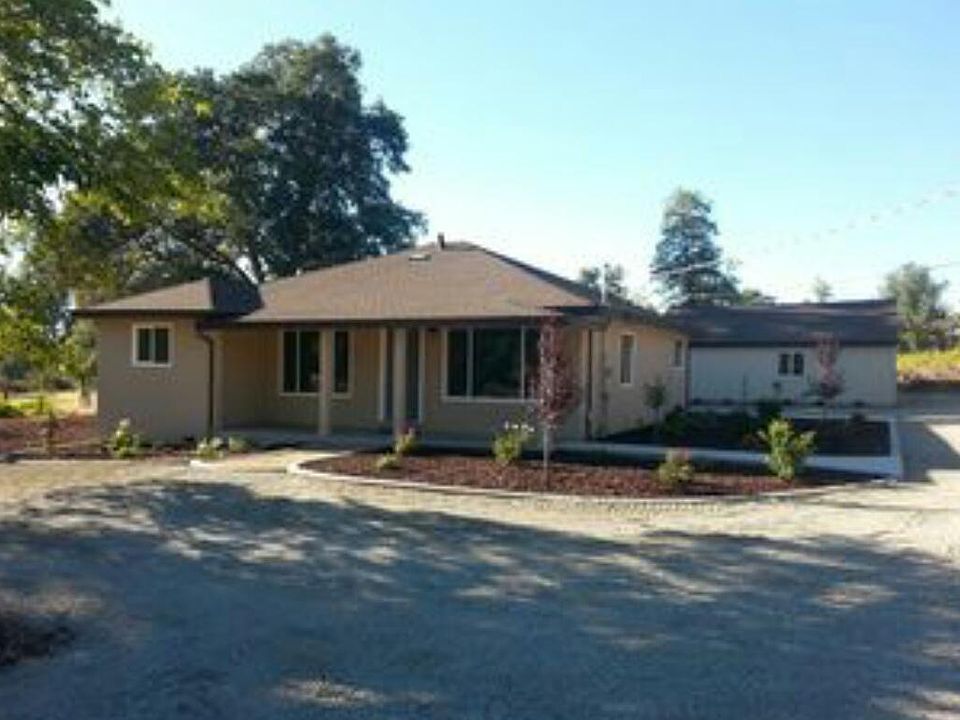 Front of house with garage in background