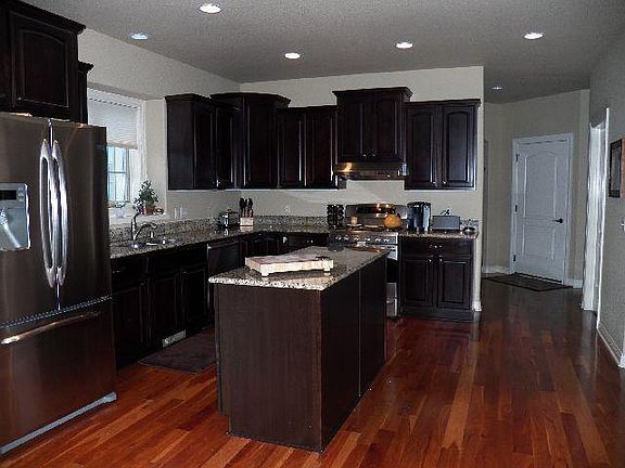 Gourmet Kitchen with wood floors and includes appliances