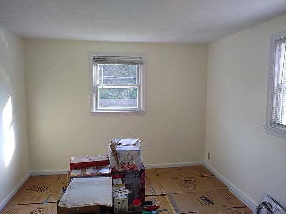 Room with floor covered for recent wall painting