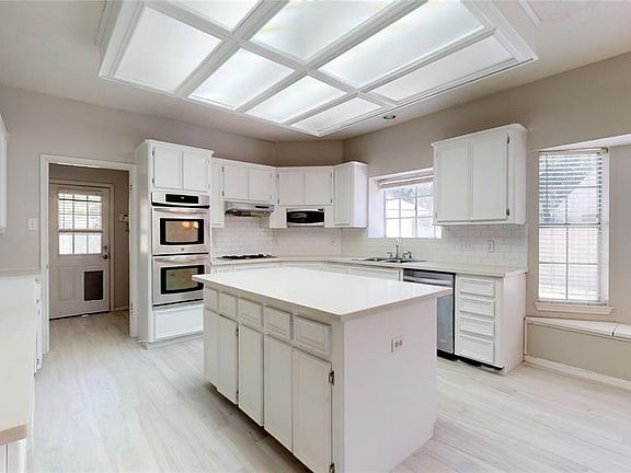 Just look at the size of the kitchen with beautiful calacatta which quartz countertops.