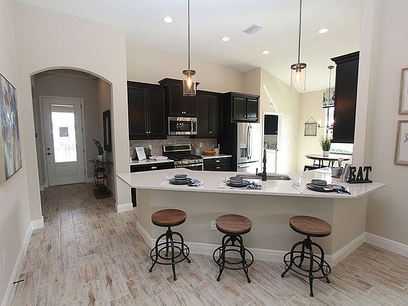 Sweetwater new home model kitchen breakfast bar William Ryan Homes Tampa