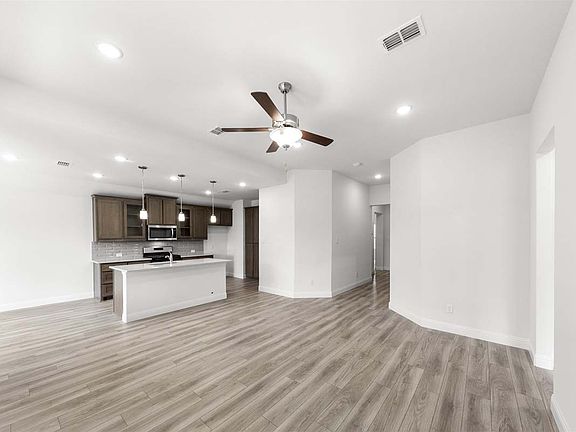 Prosper floor plan showcasing open-concept single-story living with a dining area, covered patio, an