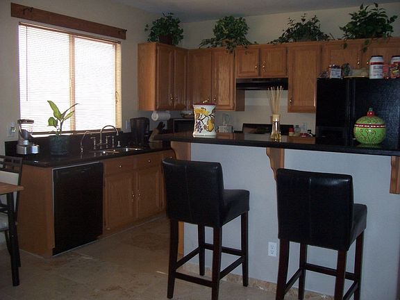 Granite Countertops, Travertine Flooring in the Kitchen