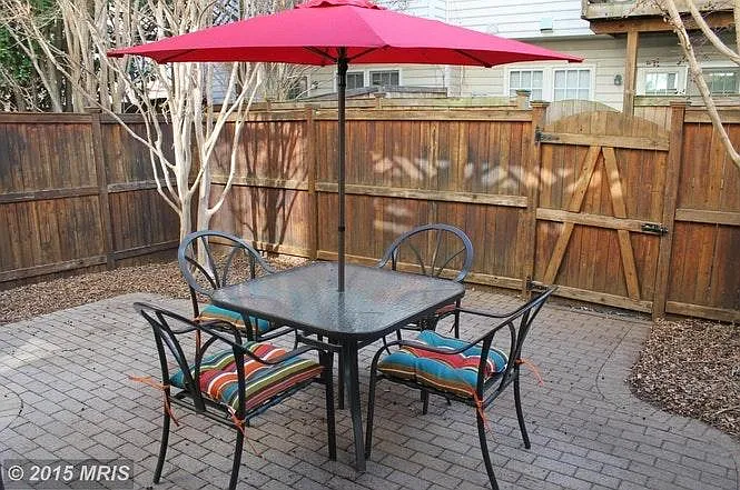 Downstairs main patio. Access to basement and two car garage.