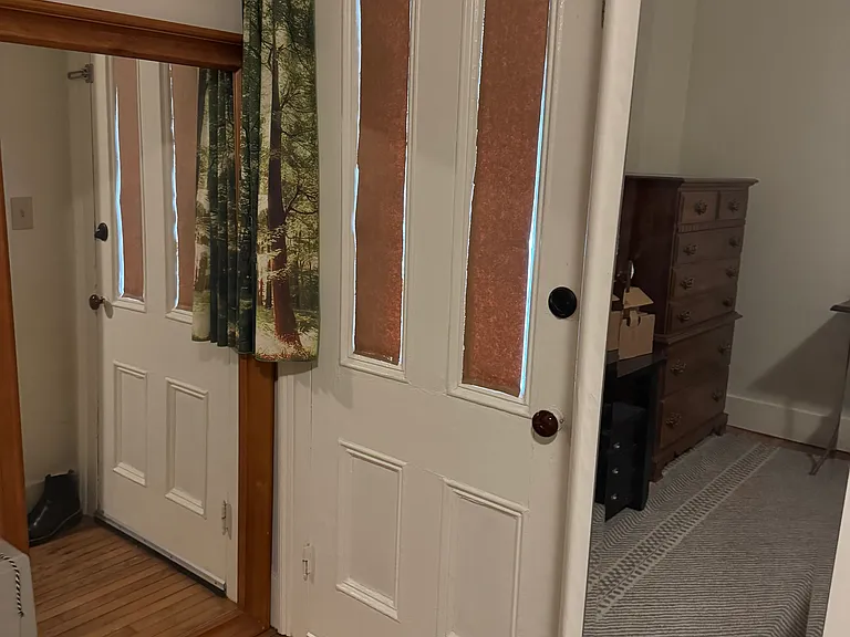 Exterior door from bedroom to side porch.