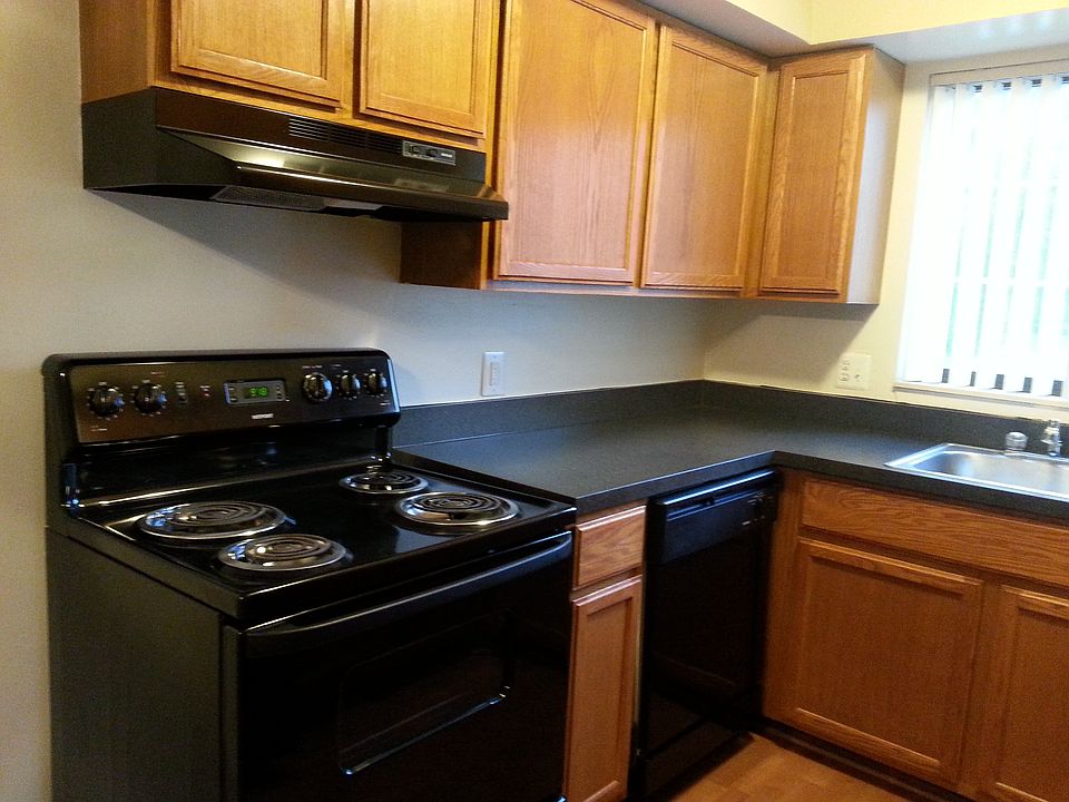 Kitchen with wood flooring throughout dining and kitchen are