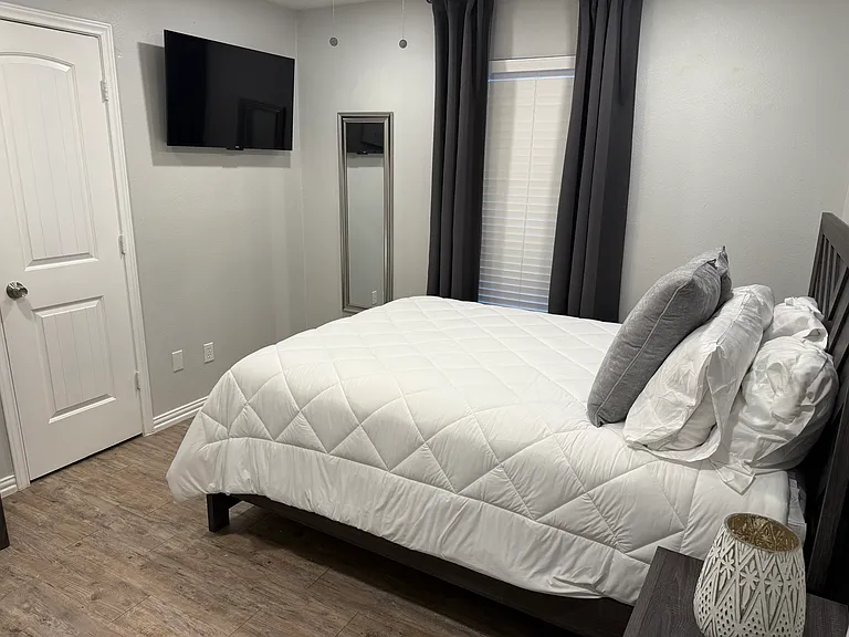 Bedroom 2 - a queen bed and smart tv.