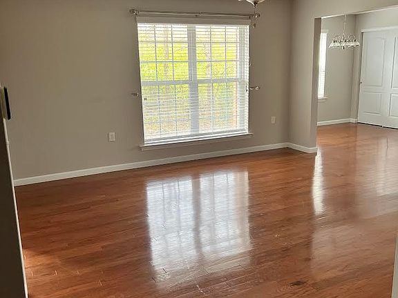 Hardwood throughout the light airy living area
