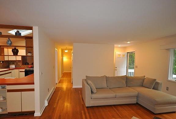 Living room opens to the kitchen, dining room, and family room.