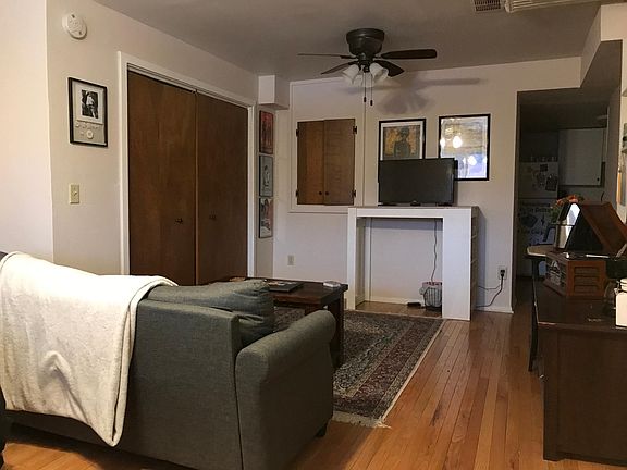 view from apartment entrance toward kitchen/bath area