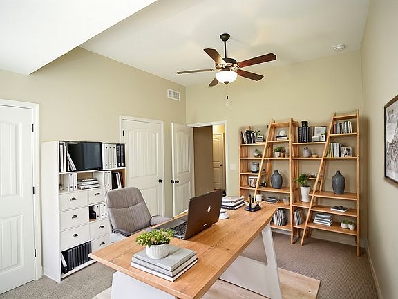 3rd bedroom on 1st floor. Can be used for an office, bedroom, kids playroom, and more.