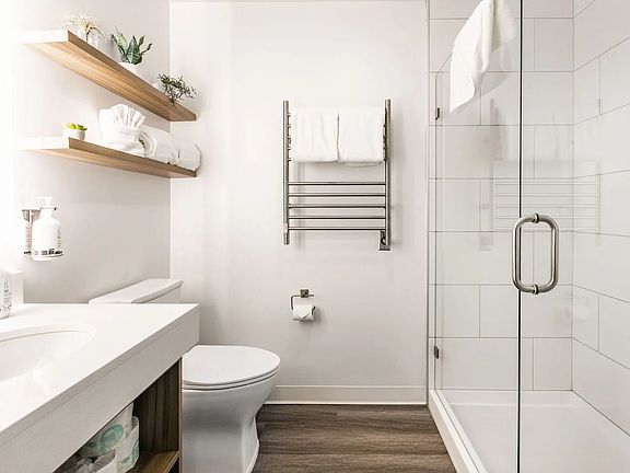 Clean elegant bathroom with cozy towel heaters!