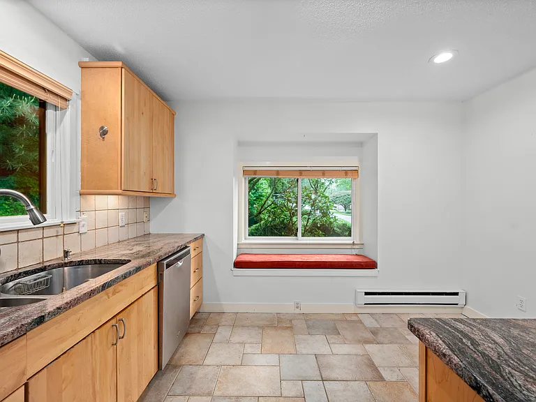 Kitchen with stainless steel appliances, cabinet underlighting, plenty of counter and cabinet space
