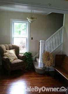 North front foyer- front staircase
						:
						Original hard wood floors