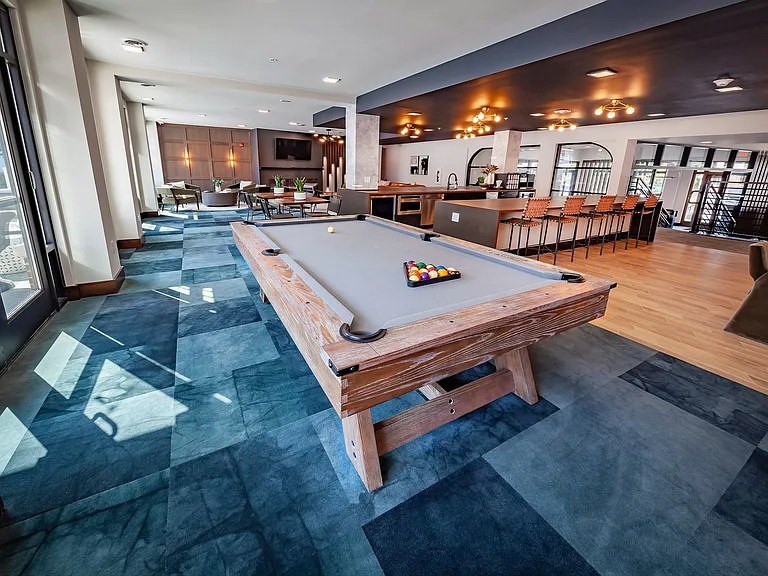 You have unlimited access to the Resident Lounge complete with billiards table, coffee bar, multiple TV, and an abundance of conversational seating.