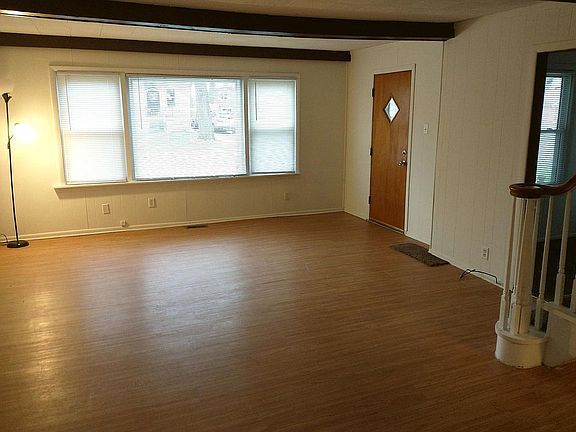 Living room with entrance to master bedroom on main floor