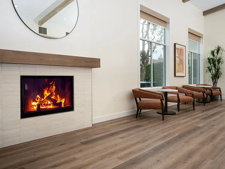 Indoor Lounge with Cozy Fireplace, Large Windows, and Casual Seating Nooks
