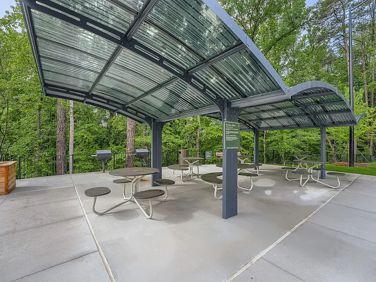 Outdoor grilling and seating area with covered shade
