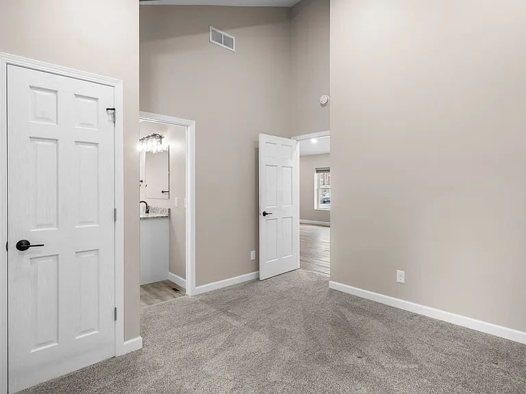 Bedroom with vaulted ceilings.