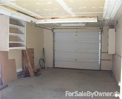 Inside of Garage/Shop w. Street. Door
						:
						Shop has adequate lighting with Breaker Box in corner.