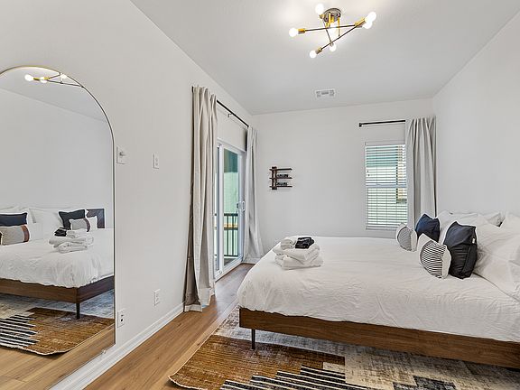 Primary bedroom with king bed + built in nightstands