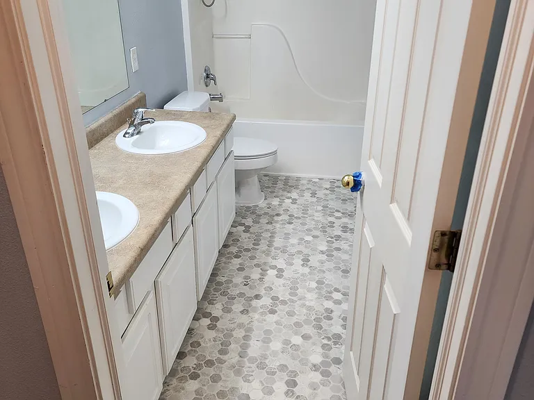 New vinyl flooring in full bath.