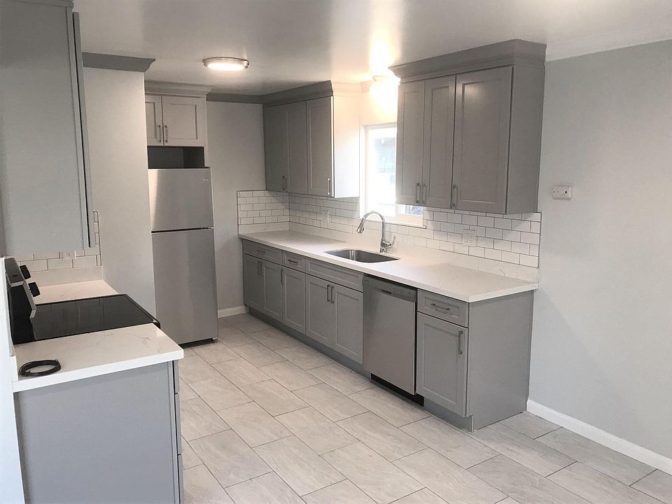Kitchen totally remodeled with new cabinets, appliances and flooring. Dishwasher included.