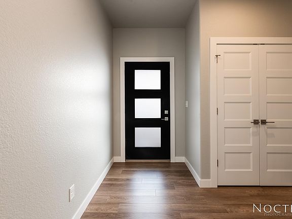 Entry way with closet. (Photo of another unit with similar finishes and quality.)