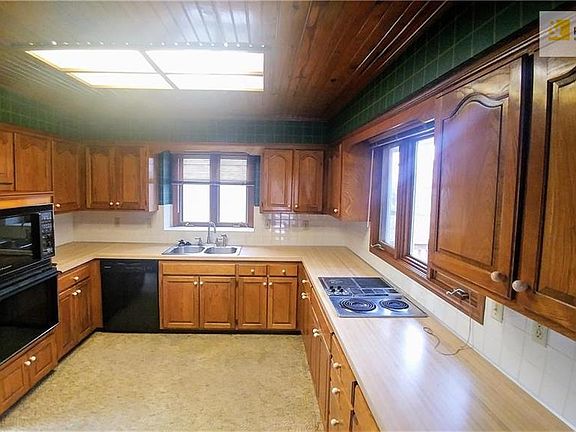 Spacious kitchen w/ lots of countertop space and cabinets! Newer dishwasher.