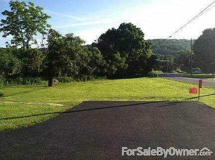 blacktop driveway with room for additional parking