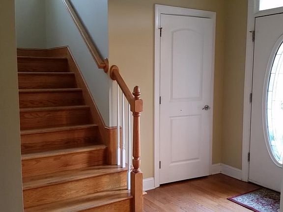 Foyer and stairs to 2nd floor with closet. Hardwood floors throughout the first floor