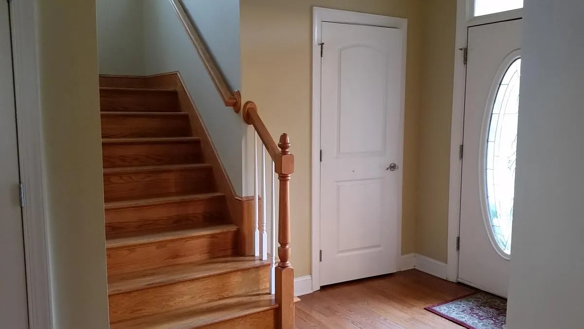 Foyer and stairs to 2nd floor with closet. Hardwood floors throughout the first floor - 53 Driftstone Cir