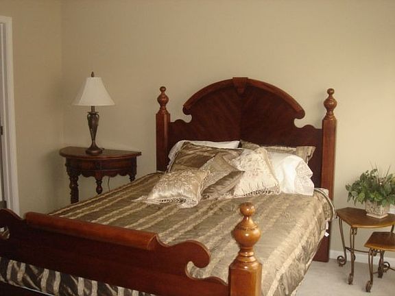 Master suite features vaulted ceiling, private bath, & walk-in closet.