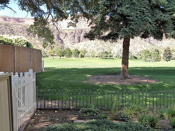 Patio with golf course and monument views