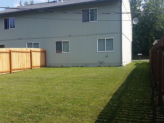 View of large, private, fenced backyard
