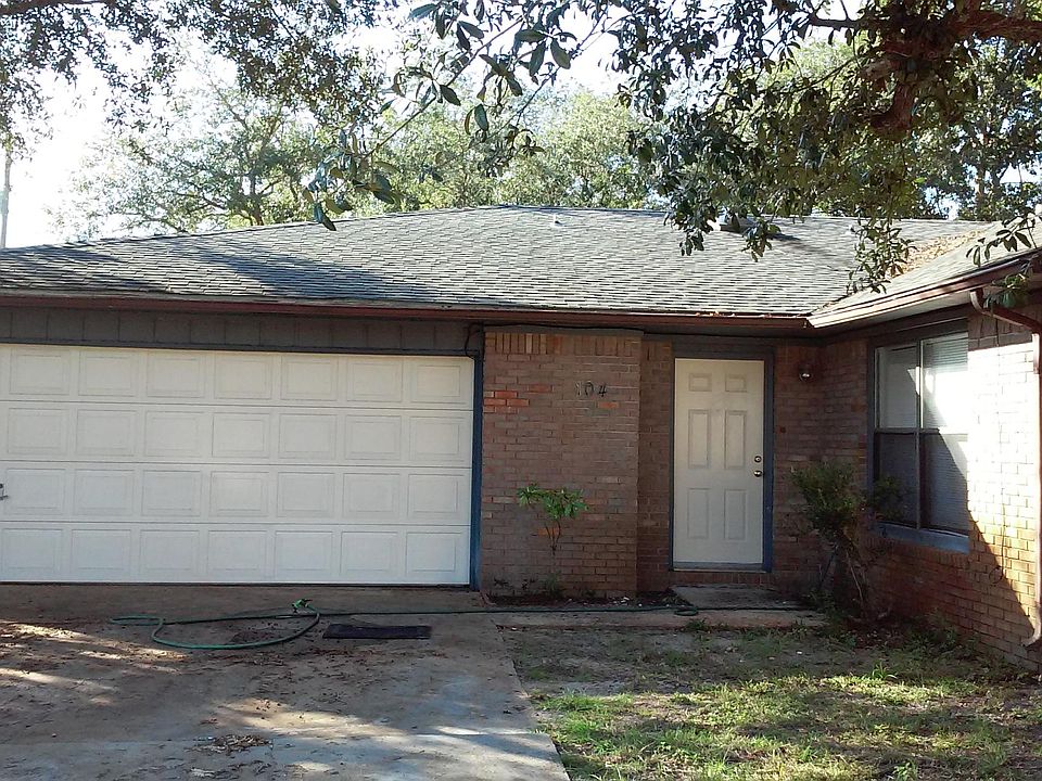 Front of unit with 2 car garage