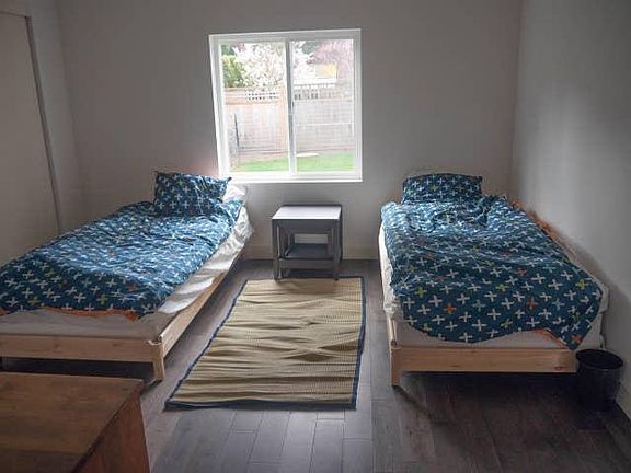 Two twin beds can be pushed together to make a king. Bedroom could fit a small desk as well.