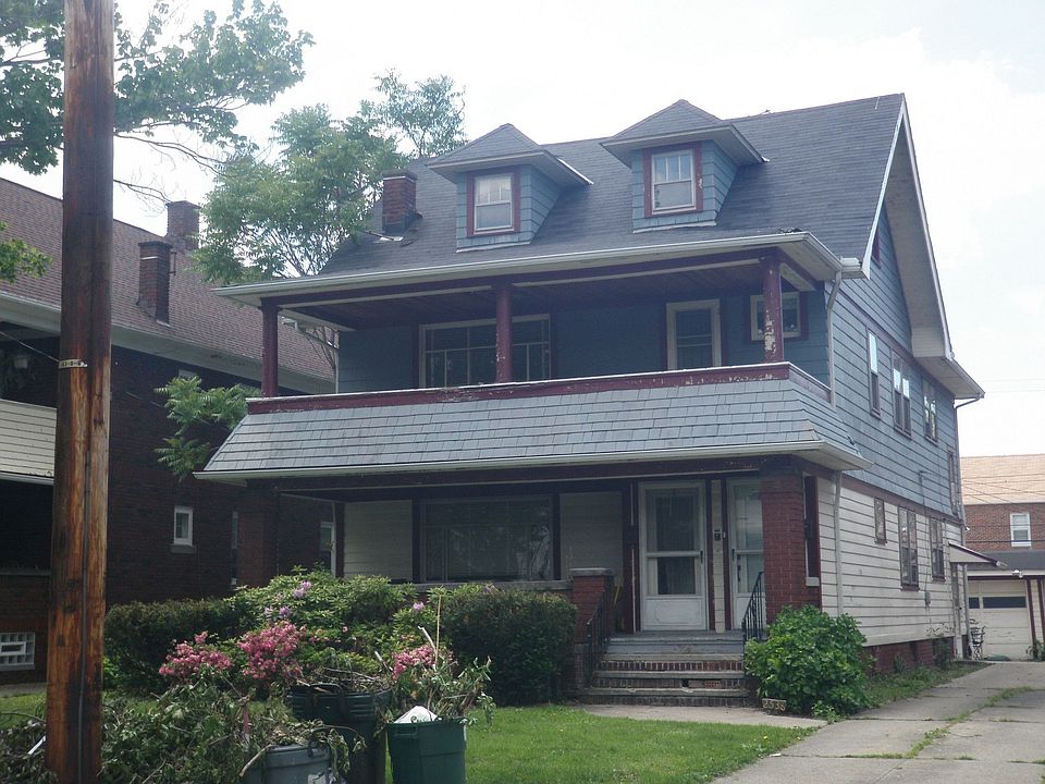 Huge front porch colonial-style two family home in the Larchmere-Shaker Square