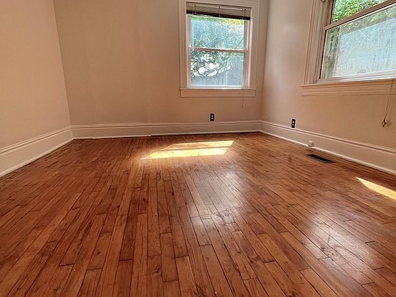 corner bedroom with 2 windows