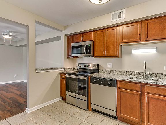 Spacious kitchen with stainless steel appliances and granite countertops