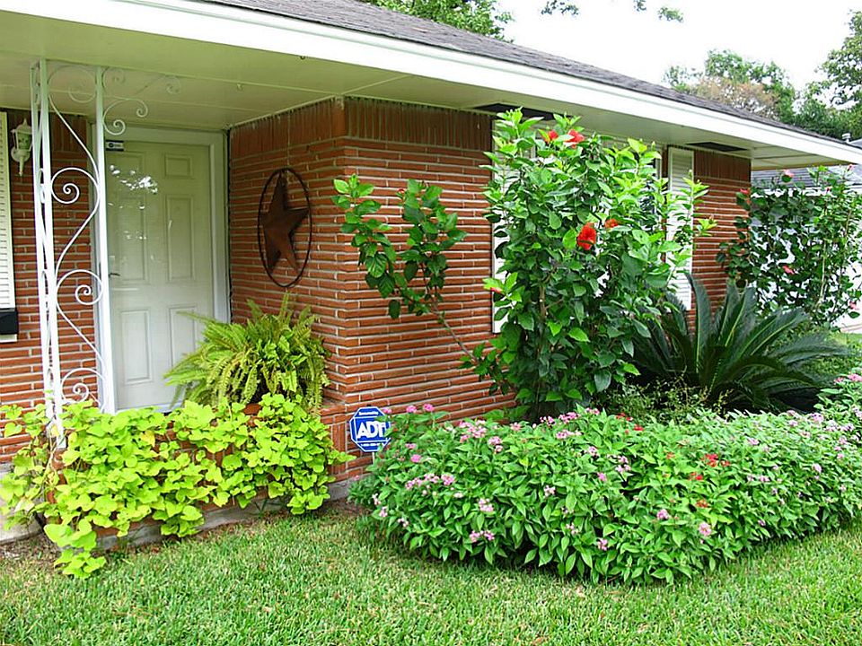 A closer look at the beautiful foliage beckoning you to come inside. The alarm system was just insta