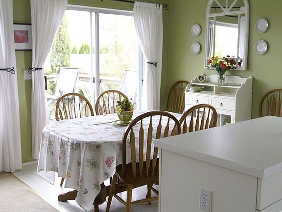 Dining room has lots of light from big windows