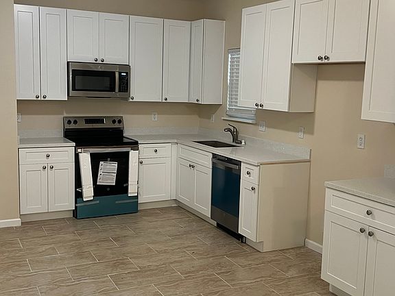 Spacious kitchen with new appliances and new cabinetry