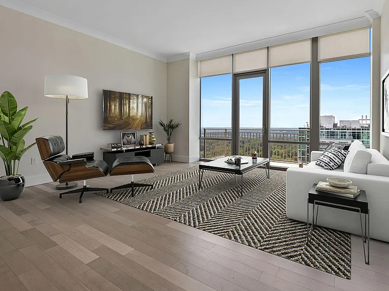 Penthouse living elevatedan expansive living space framed by floor-to-ceiling windows, refined finishes, and sweeping views that bring light, comfort, and quiet sophistication home