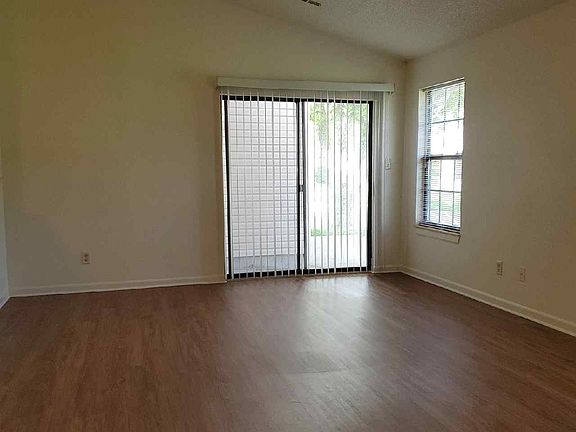 Living room with vinyl flooring all through the main living area.