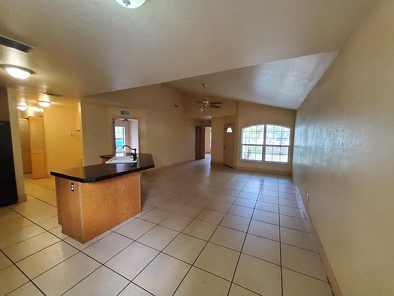 Living Room looking towards front door. Bedroom doors located on the left