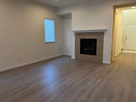 Brand new plank LVP in huge family room with fireplace