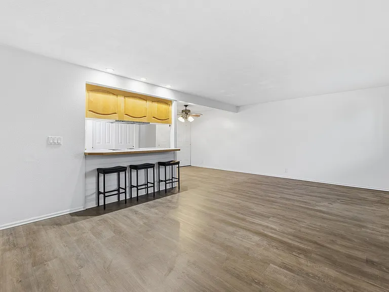 Living room with Dining area and kitchen in the background